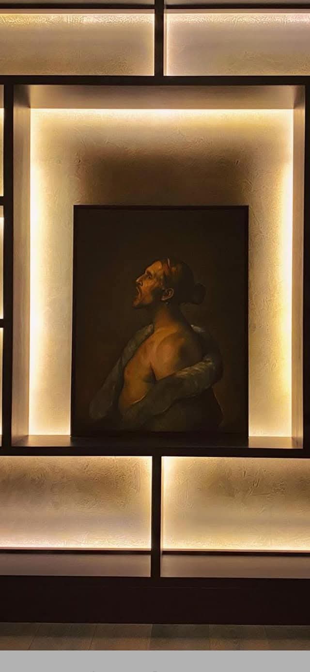 Backlit large-format stone feature wall used as a bespoke interior artwork