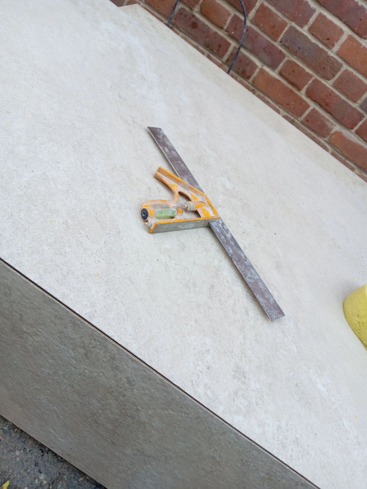 Porcelain steps being set out and templated with a square on a client's site