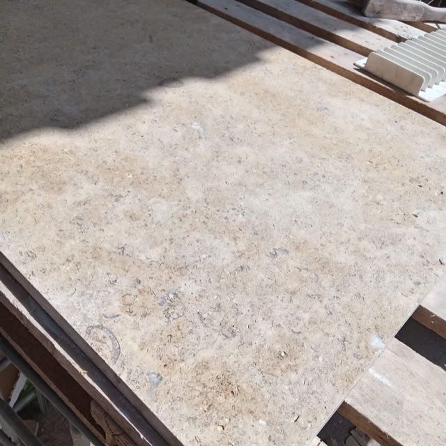 Fossil limestone paving slabs in the workshop