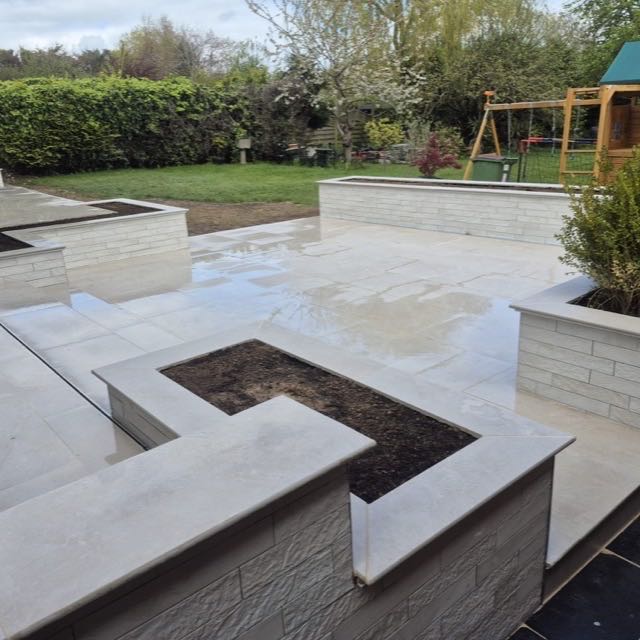 Porcelain patio with built-in planters
