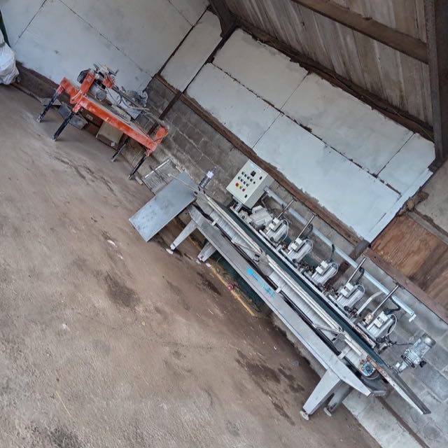 Wide view of the bullnose machine line in the workshop